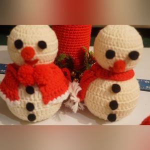 Hand knitted snowman ☃️ and Christmas candle, Christmas decor.